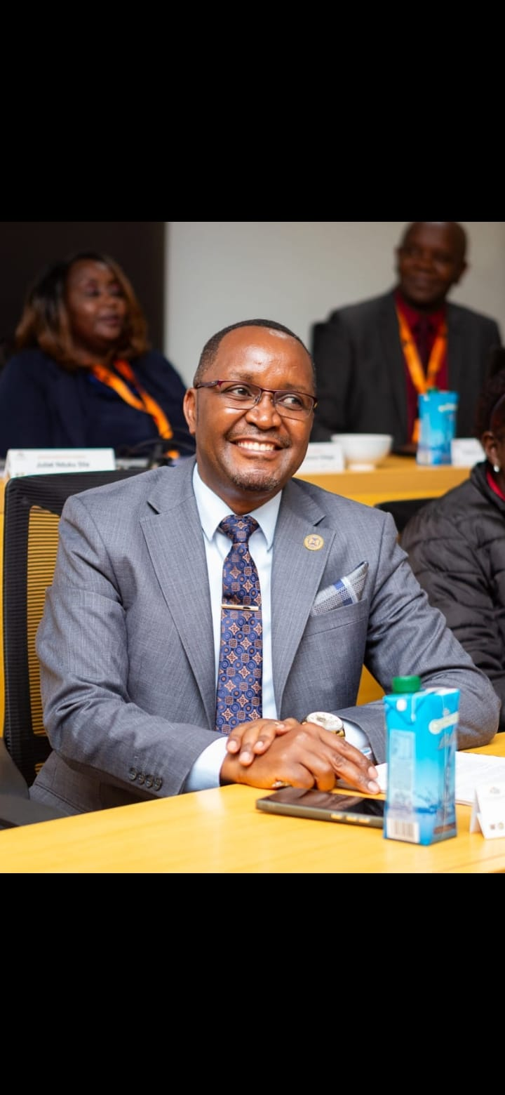 Boniface Njoroge K. at a conference table